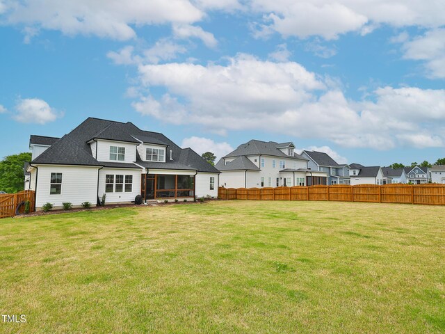 1180 Duke Farm Dr, Wake Forest, NC 27587 - back of house featuring a sunroom and a residential view