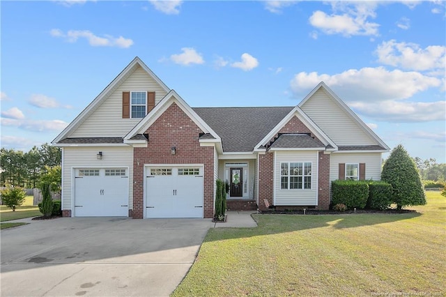 craftsman-style home with driveway, roof with shingles, a front yard, a garage, and brick siding