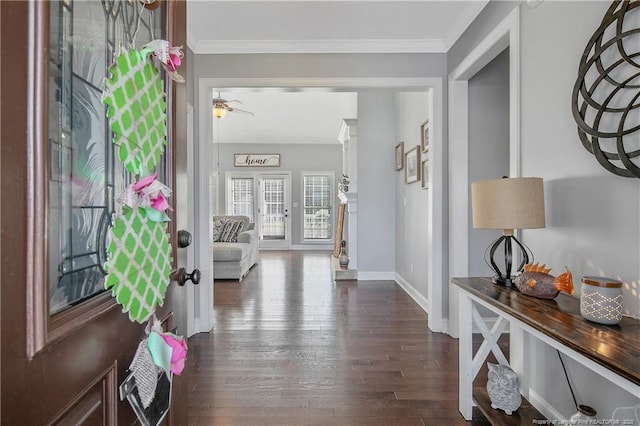 foyer with baseboards, ornamental molding, dark wood finished floors, and a ceiling fan