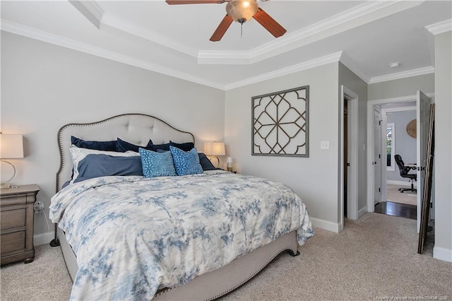 bedroom with crown molding, baseboards, light carpet, and a ceiling fan