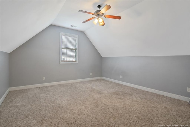 bonus room featuring a ceiling fan, visible vents, vaulted ceiling, carpet floors, and baseboards
