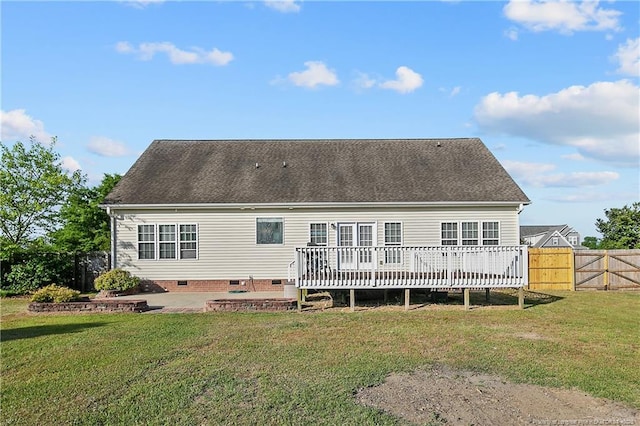 back of property featuring a deck, a fenced backyard, a patio area, crawl space, and a lawn
