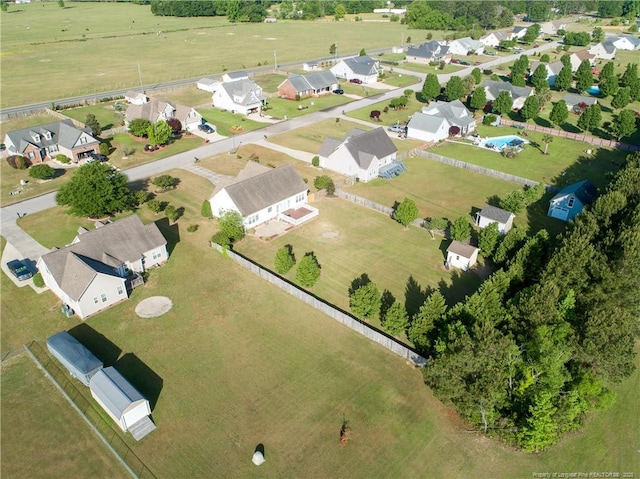 birds eye view of property with a residential view