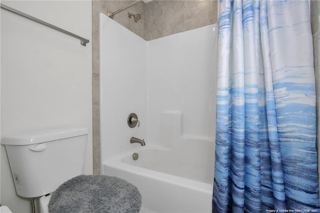 full bathroom with toilet and shower / tub combo with curtain