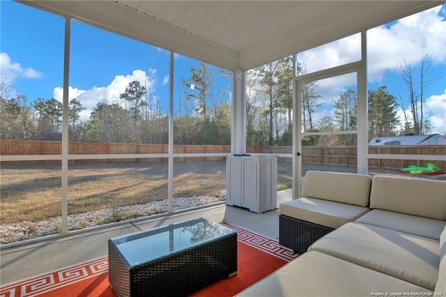 sunroom featuring outdoor lounge area