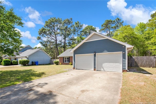 exterior space with fence and concrete driveway