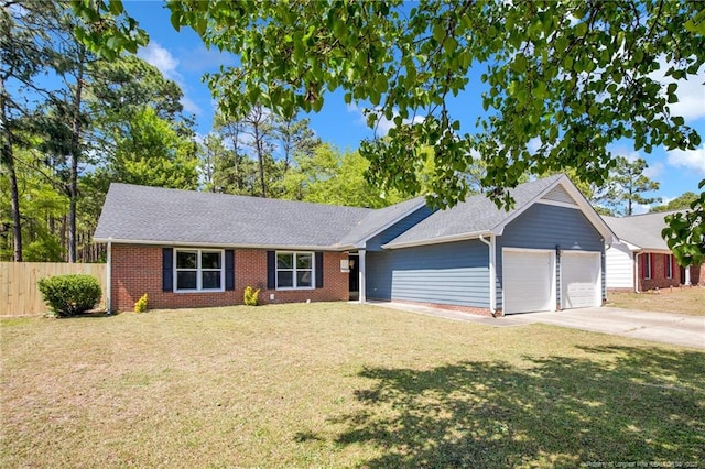 ranch-style house with an attached garage, fence, a front yard, and brick siding
