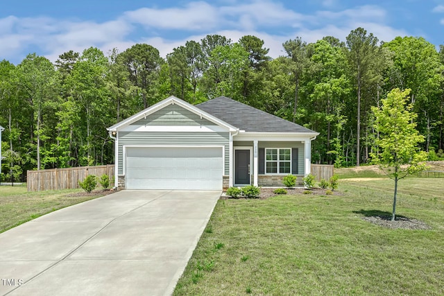 single story home featuring driveway, fence, a garage, stone siding, and a front lawn