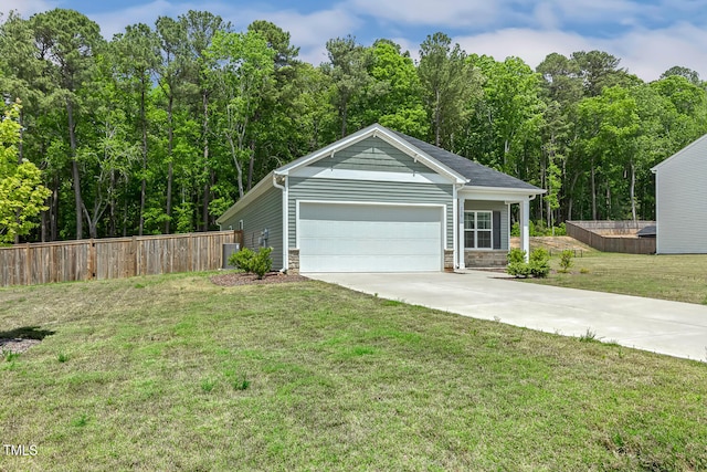 garage with fence and driveway