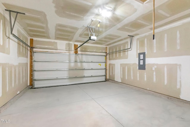 garage featuring electric panel and a garage door opener