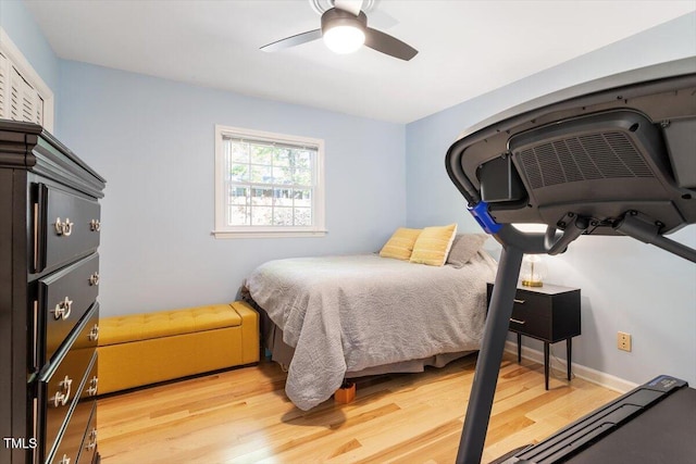 bedroom with ceiling fan and light wood-type flooring