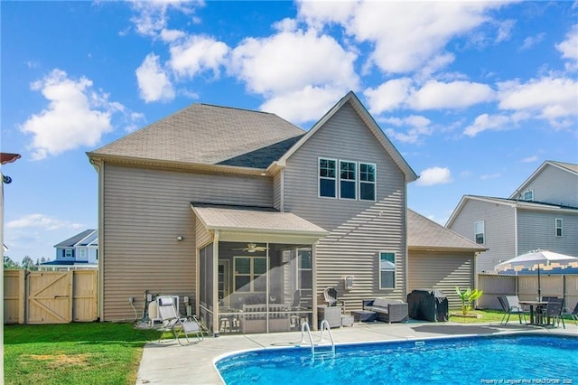 308 Wishaw Ct, Hope Mills, NC 28348 - back of house with a sunroom, a fenced in pool, a gate, a fenced backyard, and a patio area