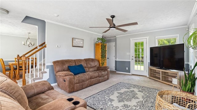 carpeted living area with baseboards, ornamental molding, a textured ceiling, and ceiling fan with notable chandelier