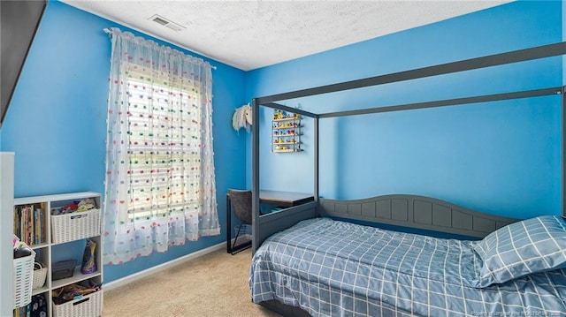 carpeted bedroom with baseboards, a textured ceiling, and visible vents