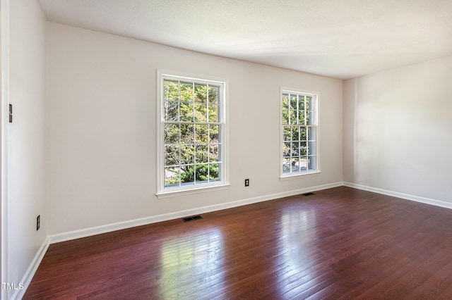 1324 Swallow Dr, Raleigh, NC 27606 - empty room featuring dark wood-type flooring and baseboards