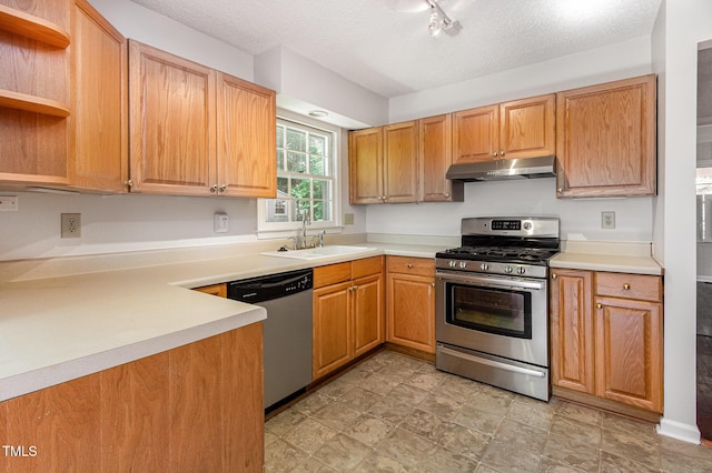 1324 Swallow Dr, Raleigh, NC 27606 - kitchen with appliances with stainless steel finishes, a sink, under cabinet range hood, open shelves, and light countertops