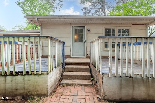 doorway to property featuring a deck
