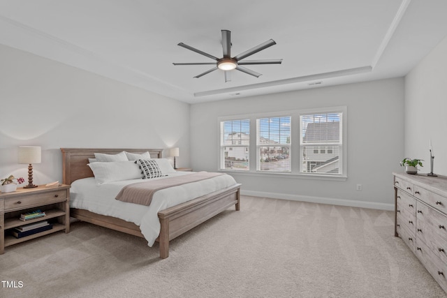 bedroom featuring light carpet, baseboards, and ceiling fan
