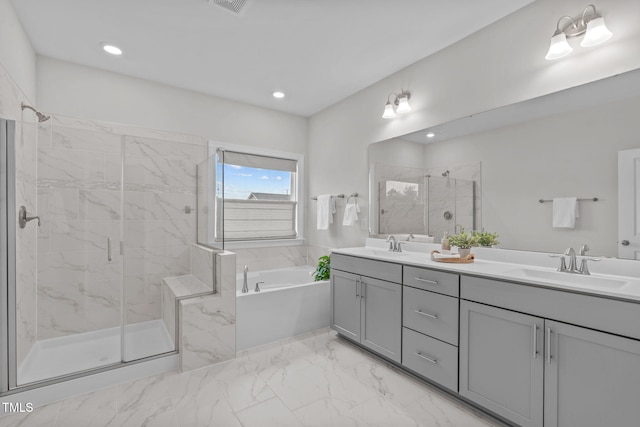 bathroom featuring a marble finish shower, a bath, double vanity, marble finish floors, and recessed lighting