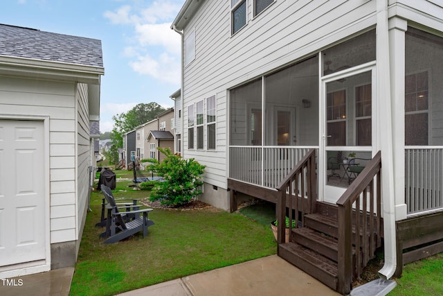 view of grassy yard with a sunroom