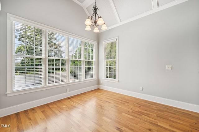 204 Plantation Dr, Youngsville, NC 27596 - empty room featuring a chandelier, light wood-style flooring, and lofted ceiling