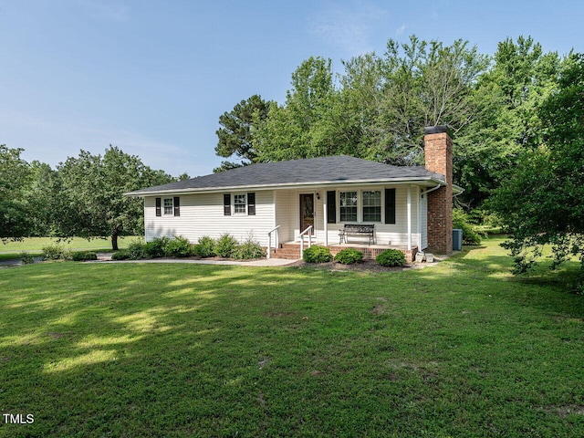 1612 Bethlehem Rd, Knightdale, NC 27545 - ranch-style house featuring a chimney, a porch, a front yard, and central AC