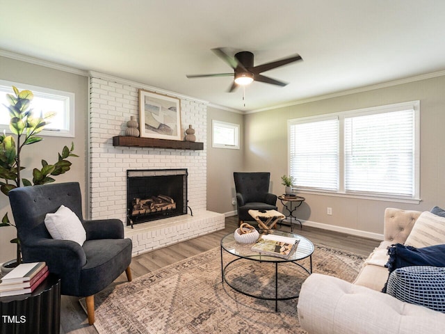 1612 Bethlehem Rd, Knightdale, NC 27545 - living room with ceiling fan, a fireplace, wood finished floors, plenty of natural light, and crown molding