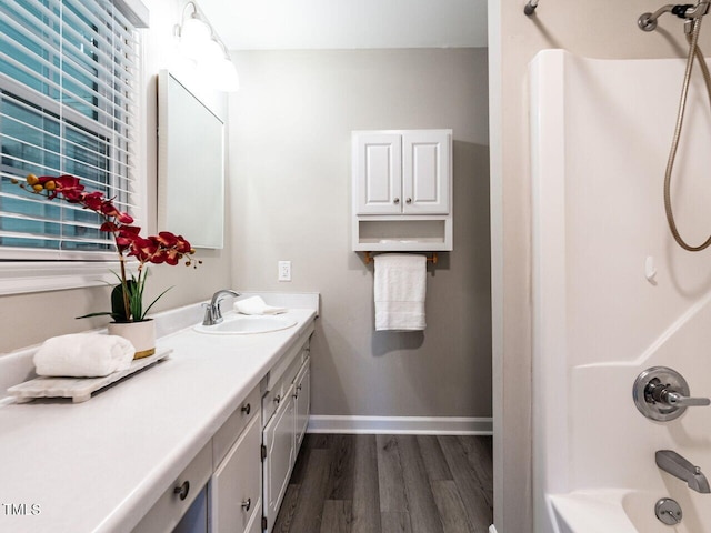 1612 Bethlehem Rd, Knightdale, NC 27545 - full bathroom featuring vanity, wood finished floors, shower / tub combination, and baseboards