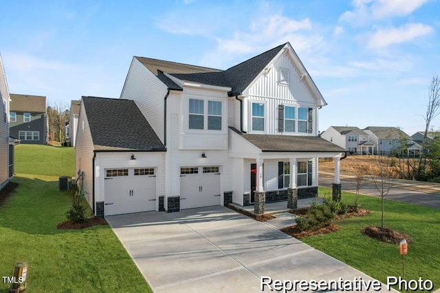view of front of property with central AC, a front lawn, board and batten siding, a porch, and driveway