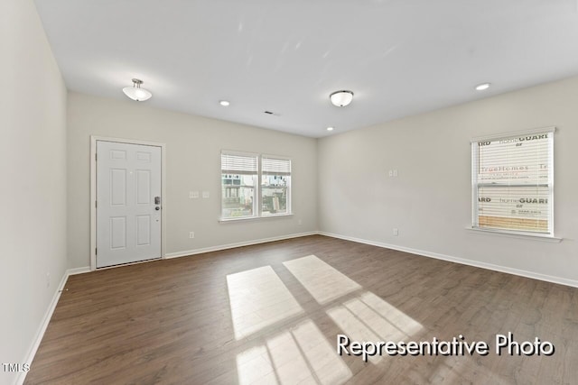 260 Curling Creek Dr Unit 235P, Clayton, NC 27527 - unfurnished room with dark wood-type flooring, baseboards, and recessed lighting