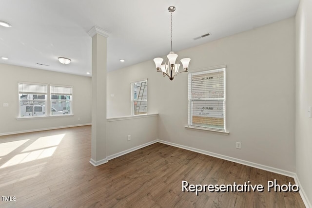 260 Curling Creek Dr Unit 235P, Clayton, NC 27527 - spare room featuring wood finished floors, a chandelier, baseboards, and recessed lighting