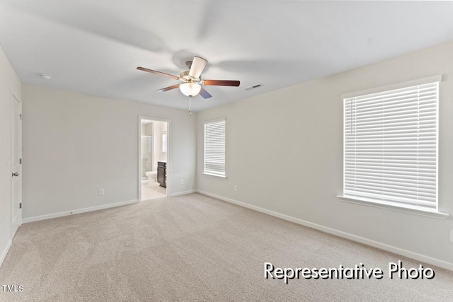 260 Curling Creek Dr Unit 235P, Clayton, NC 27527 - unfurnished bedroom with baseboards, light carpet, ensuite bathroom, and ceiling fan