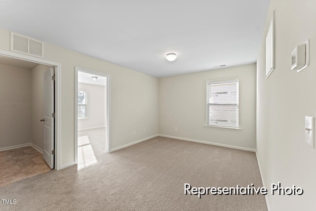 260 Curling Creek Dr Unit 235P, Clayton, NC 27527 - carpeted spare room featuring plenty of natural light and baseboards