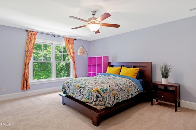 bedroom with carpet floors, baseboards, and ceiling fan