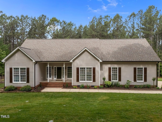 3653 Range Rd, Stem, NC 27581 - ranch-style home with a shingled roof, a front lawn, and a porch