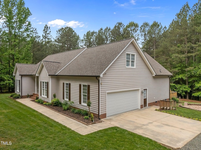 3653 Range Rd, Stem, NC 27581 - view of front of house with roof with shingles, concrete driveway, a front yard, and a garage