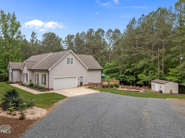 3653 Range Rd, Stem, NC 27581 - view of front of home with driveway, an outbuilding, roof with shingles, and a front yard