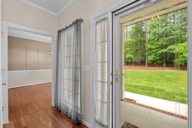 3653 Range Rd, Stem, NC 27581 - doorway featuring ornamental molding, wood finished floors, and baseboards