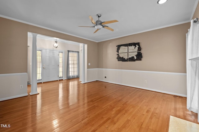 3653 Range Rd, Stem, NC 27581 - empty room featuring a ceiling fan, light wood-style flooring, ornamental molding, baseboards, and ornate columns
