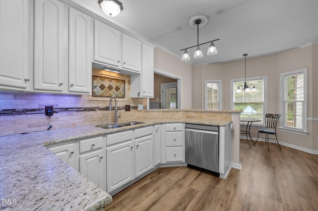 3653 Range Rd, Stem, NC 27581 - kitchen featuring dishwasher, a sink, backsplash, white cabinets, and light wood-type flooring