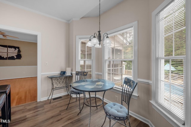 3653 Range Rd, Stem, NC 27581 - dining space with a chandelier, wood finished floors, ornamental molding, and baseboards