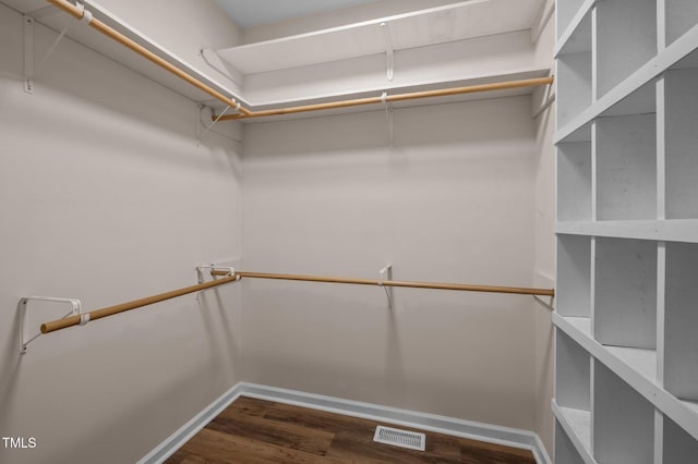 3653 Range Rd, Stem, NC 27581 - walk in closet with dark wood-style flooring