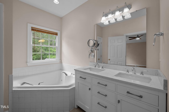 3653 Range Rd, Stem, NC 27581 - bathroom with a garden tub, double vanity, and a ceiling fan