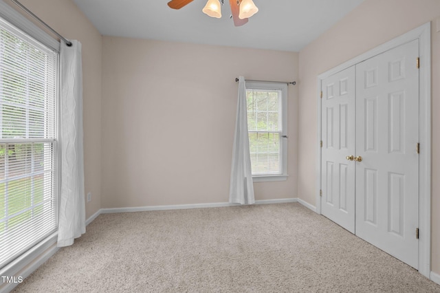 3653 Range Rd, Stem, NC 27581 - unfurnished bedroom with carpet floors, a closet, baseboards, and ceiling fan