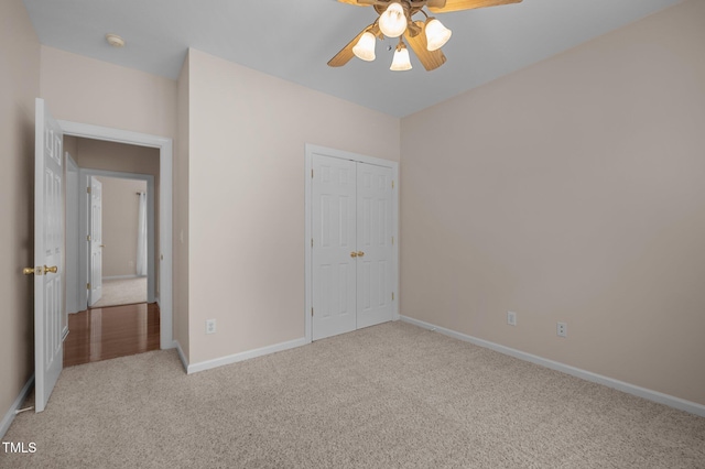 3653 Range Rd, Stem, NC 27581 - unfurnished bedroom featuring carpet floors, baseboards, a closet, and a ceiling fan