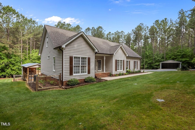 3653 Range Rd, Stem, NC 27581 - view of front of house featuring a front yard and a shingled roof