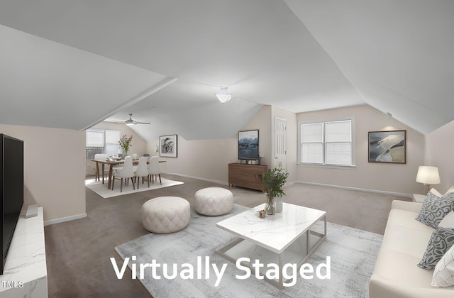 3653 Range Rd, Stem, NC 27581 - living room featuring lofted ceiling, healthy amount of natural light, baseboards, and carpet flooring