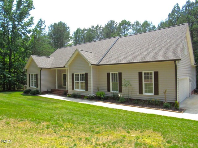 3653 Range Rd, Stem, NC 27581 - single story home with a garage, a shingled roof, a front yard, and driveway