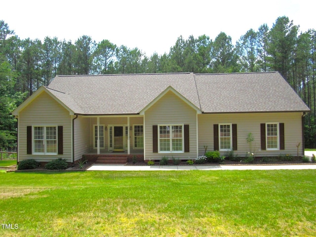 3653 Range Rd, Stem, NC 27581 - ranch-style house featuring a front lawn and roof with shingles