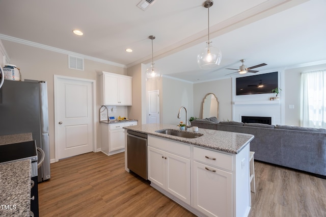 4524 Sweet Williams Ln NW, Wilson, NC 27896 - kitchen with a sink, stainless steel dishwasher, ornamental molding, and wood finished floors